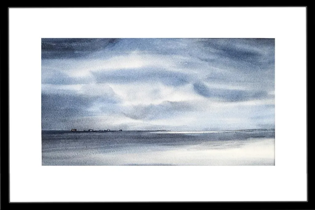 Langt ute i havgapet  ligger noen hus på en tynn odde