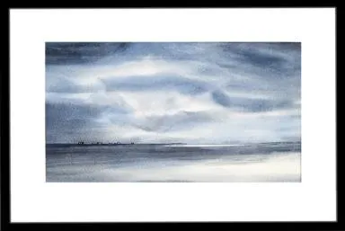 Langt ute i havgapet  ligger noen hus på en tynn odde